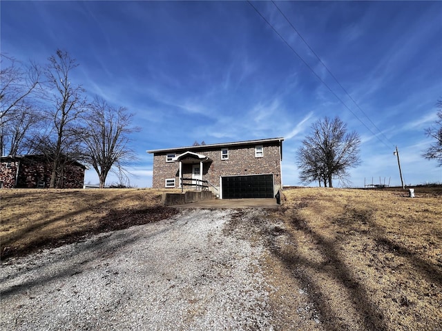 view of front of house with a garage and driveway