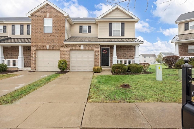 townhome / multi-family property featuring a garage, covered porch, and a front lawn