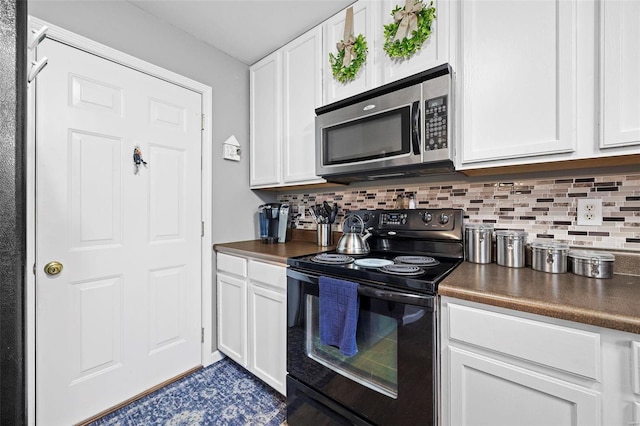 kitchen featuring white cabinetry, black range with electric stovetop, and tasteful backsplash