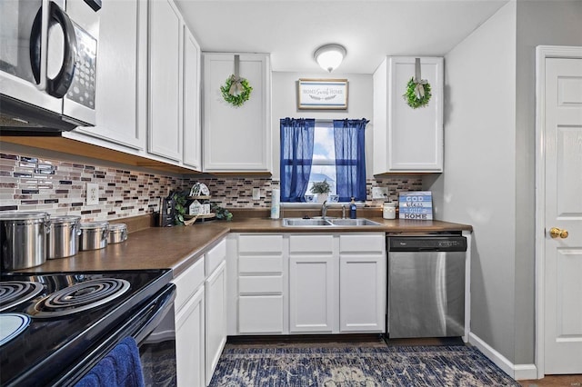 kitchen with white cabinetry, sink, and appliances with stainless steel finishes