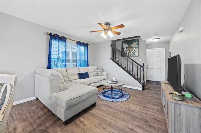 living room featuring ceiling fan and wood-type flooring