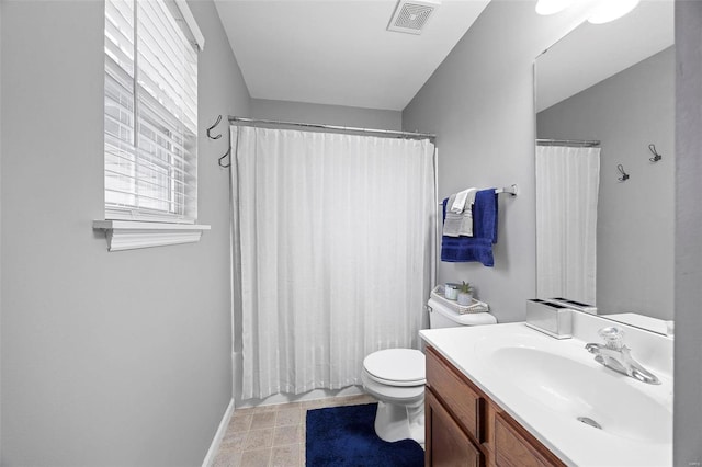 full bathroom featuring vanity, shower / bath combination with curtain, and toilet