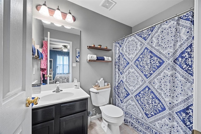 bathroom featuring tile patterned floors, vanity, toilet, and a shower with shower curtain