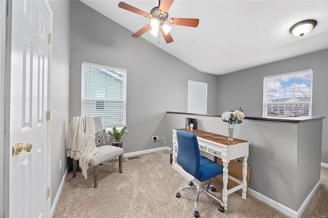 home office featuring vaulted ceiling, plenty of natural light, and light colored carpet