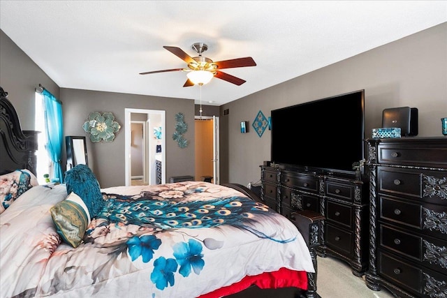 bedroom featuring ceiling fan and light colored carpet