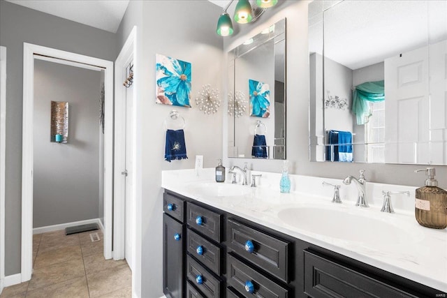 bathroom with vanity and tile patterned floors