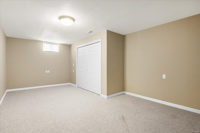 unfurnished bedroom featuring a closet and carpet