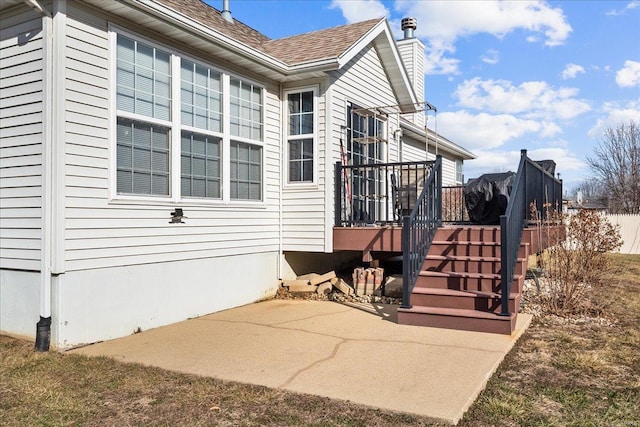 view of side of property with a patio