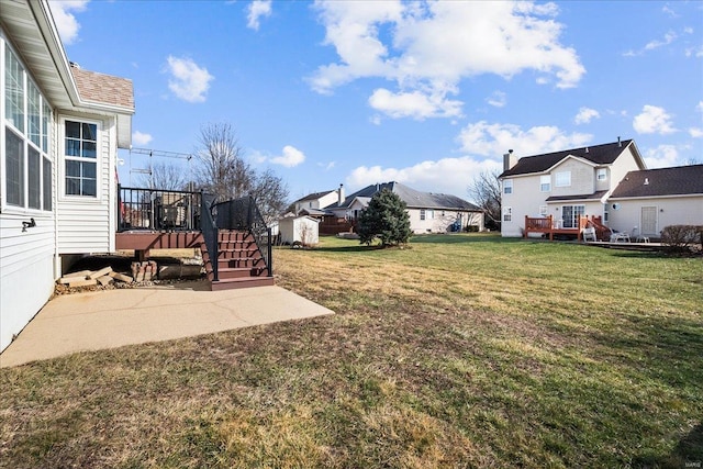 view of yard featuring a patio area and a deck