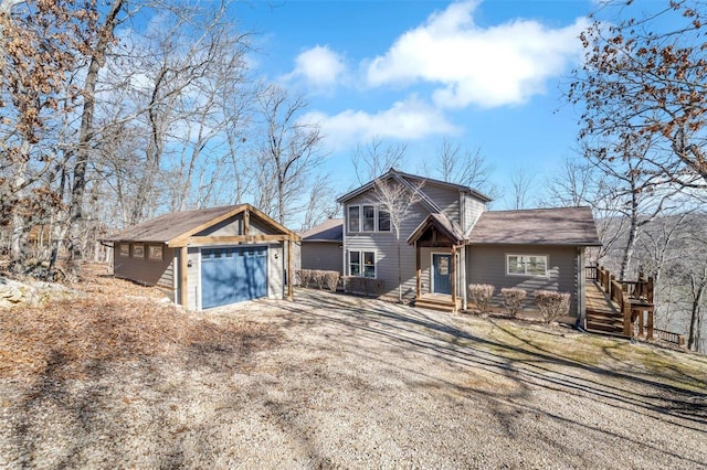 chalet / cabin featuring an outbuilding, a detached garage, and entry steps