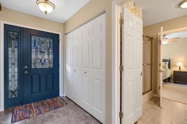 foyer featuring baseboards