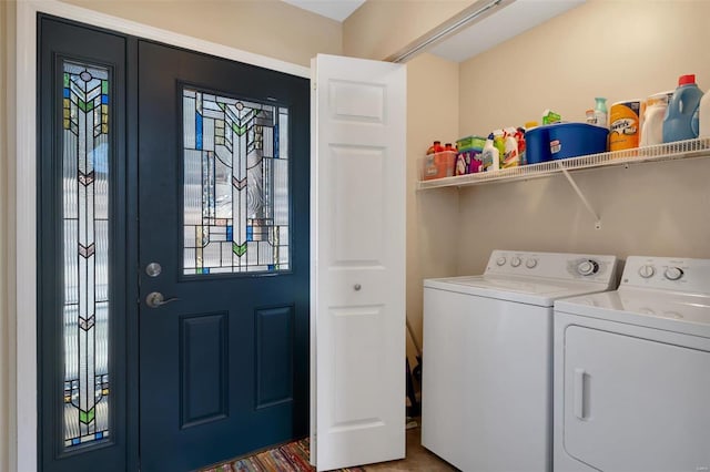 laundry room with laundry area and washing machine and clothes dryer