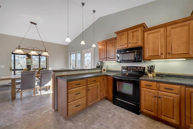 kitchen with brown cabinets, decorative light fixtures, dark countertops, a peninsula, and black appliances