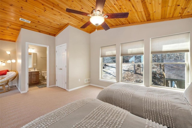 bedroom featuring lofted ceiling, wood ceiling, and baseboards