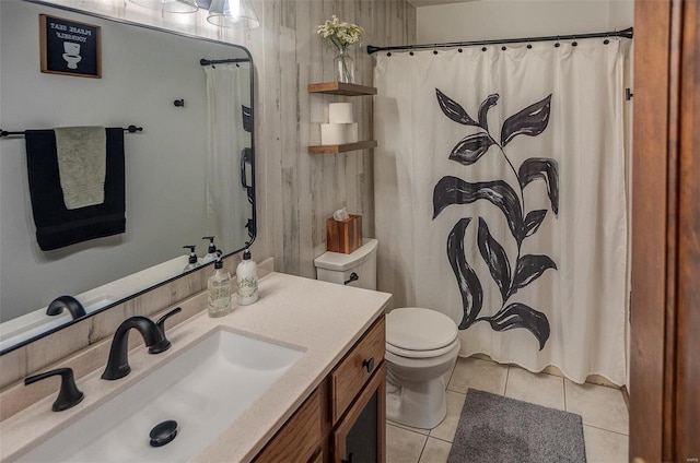 bathroom featuring tile patterned flooring, vanity, and toilet