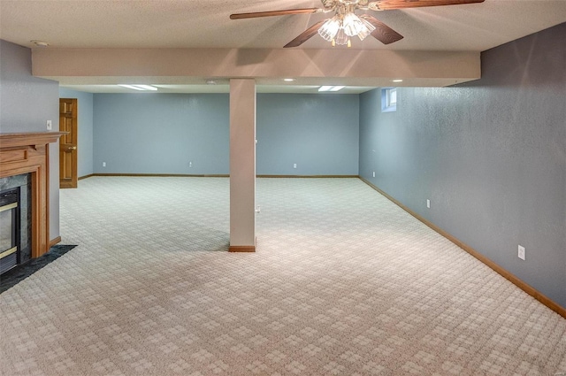 basement with light carpet, a high end fireplace, and a textured ceiling