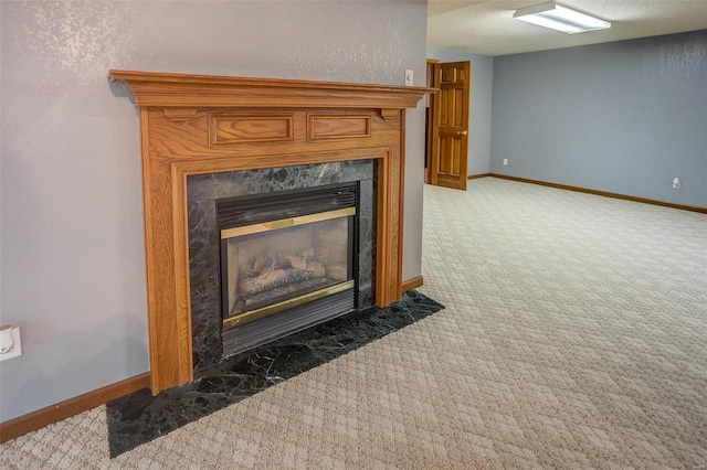 details featuring a high end fireplace, carpet flooring, and a textured ceiling