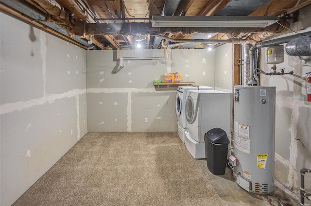 basement with washer and clothes dryer and gas water heater