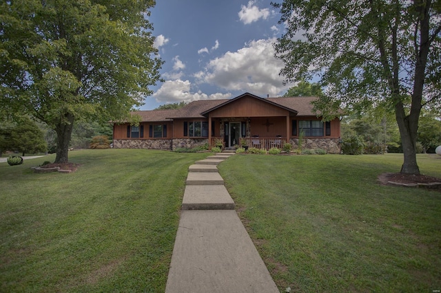 ranch-style home with covered porch and a front yard