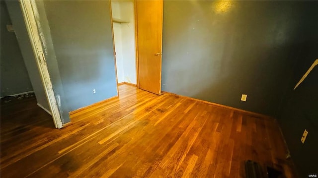 unfurnished bedroom featuring hardwood / wood-style floors