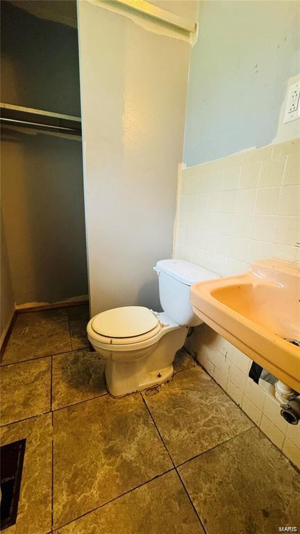 bathroom featuring tile patterned floors and toilet