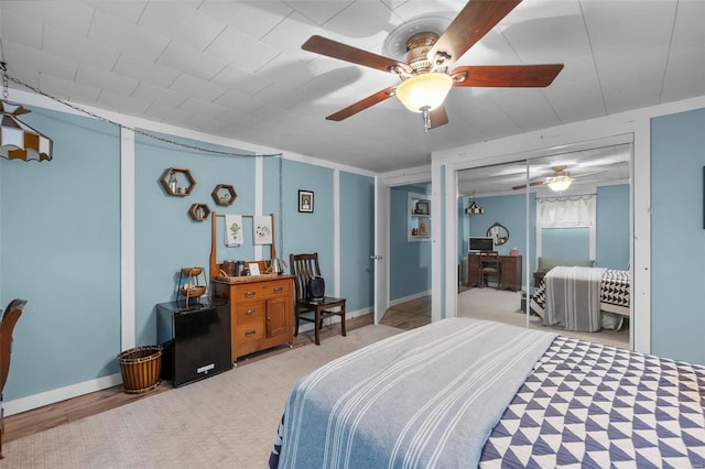 bedroom featuring ceiling fan and a closet