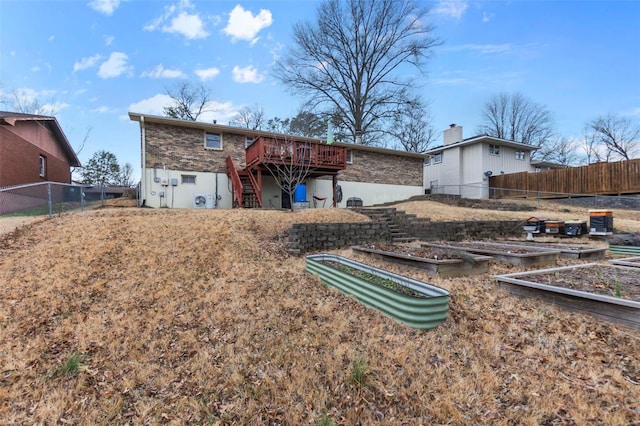 back of property with a deck