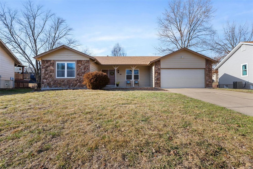 ranch-style home featuring a garage and a front yard