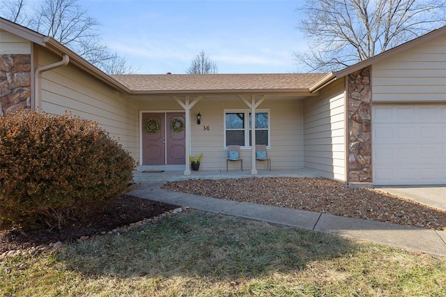 property entrance featuring a garage and a porch