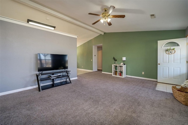 living room featuring lofted ceiling with beams, ceiling fan, and carpet flooring