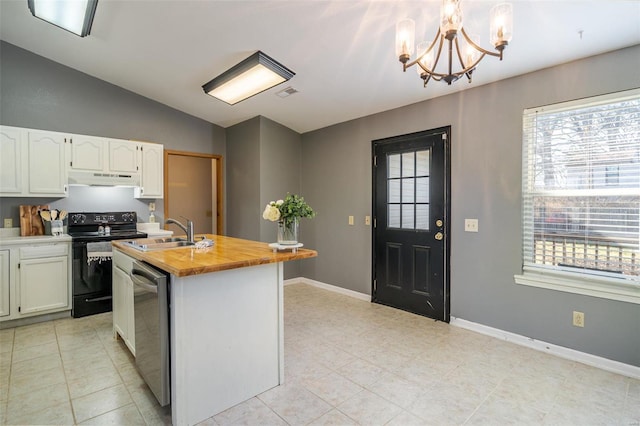 kitchen featuring decorative light fixtures, black / electric stove, stainless steel dishwasher, a kitchen island with sink, and white cabinets