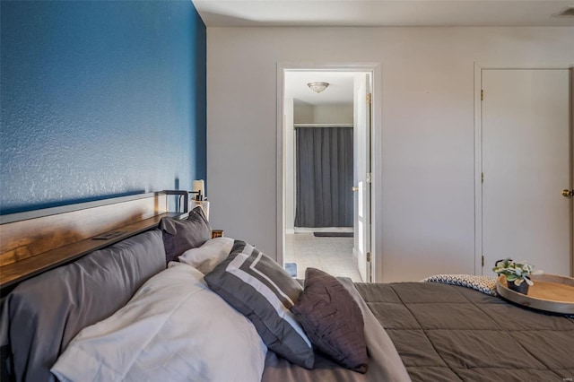 tiled bedroom with ensuite bath