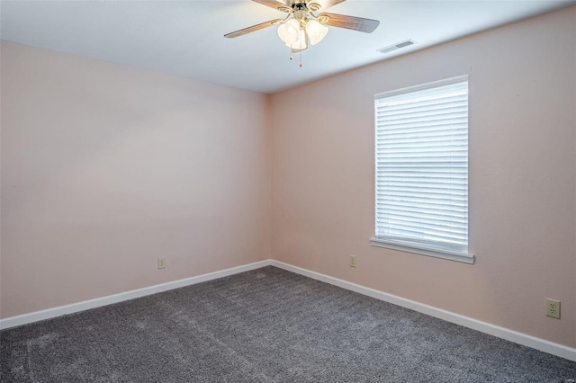 carpeted spare room with ceiling fan