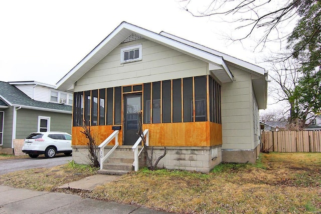 view of front of property featuring a sunroom