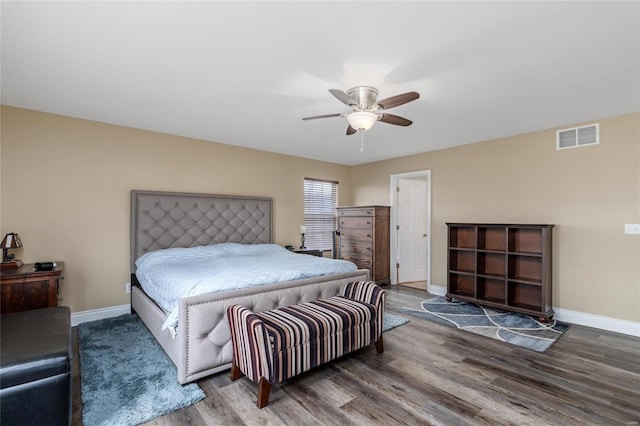 bedroom with dark wood-type flooring and ceiling fan