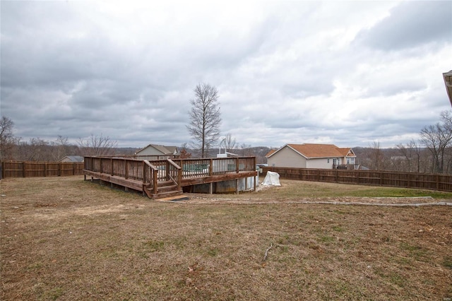 view of yard featuring a wooden deck