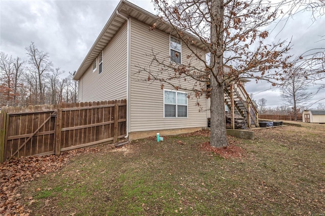 view of side of home featuring a lawn