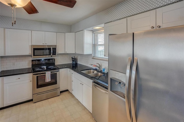 kitchen with white cabinetry, sink, and appliances with stainless steel finishes