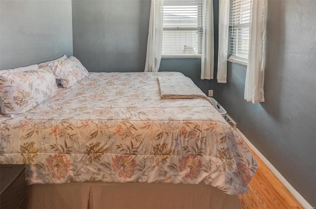 bedroom with hardwood / wood-style floors