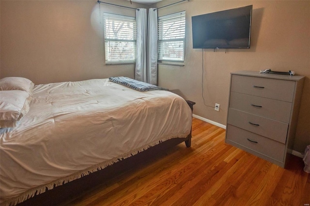 bedroom with light hardwood / wood-style floors