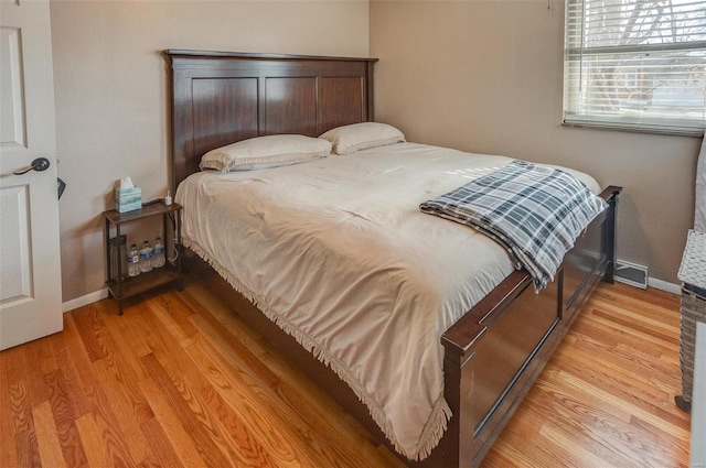 bedroom with light wood-type flooring