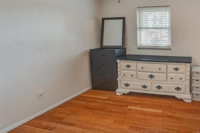 unfurnished bedroom featuring light wood-type flooring