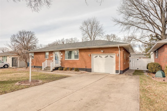 single story home featuring a garage and a front lawn