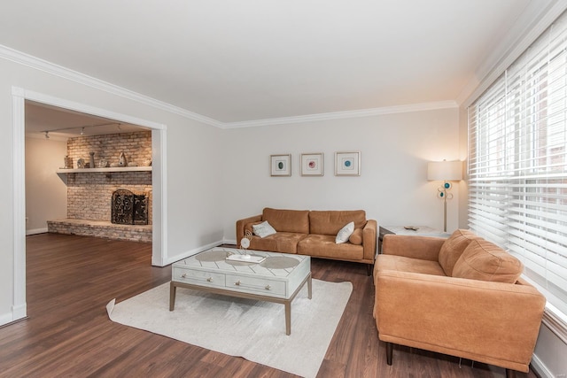 living room with a brick fireplace, crown molding, and dark wood-type flooring