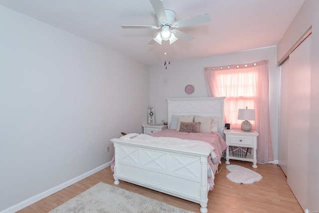 bedroom with ceiling fan and light hardwood / wood-style floors