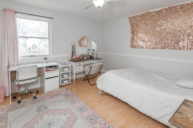 bedroom with ceiling fan and wood-type flooring