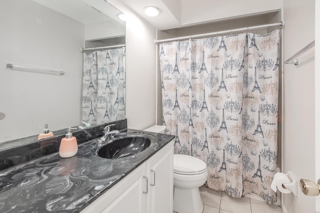 bathroom with vanity, tile patterned floors, and toilet