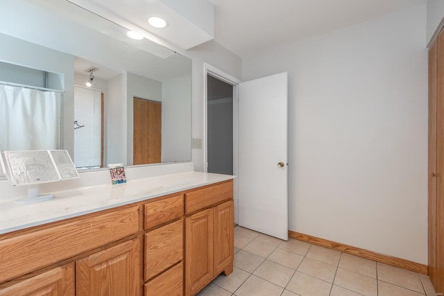 bathroom featuring tile patterned floors and vanity