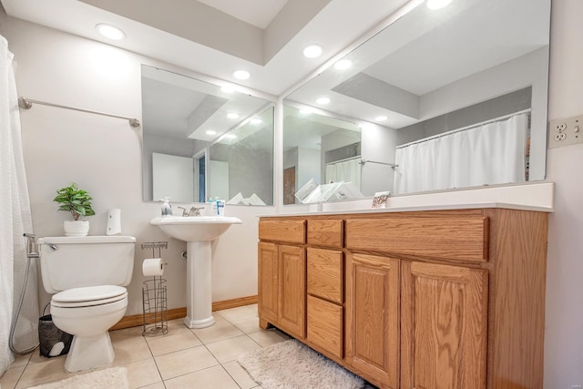 bathroom with toilet and tile patterned flooring