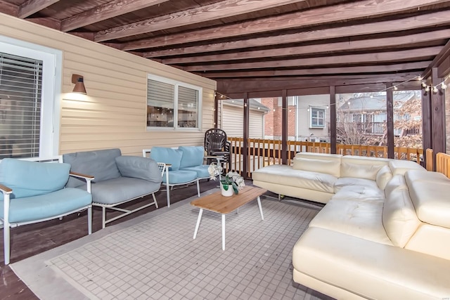 sunroom / solarium with beam ceiling and plenty of natural light